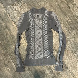 Athletic Essentials performance pullover. Zipper neck. Thumb holes.